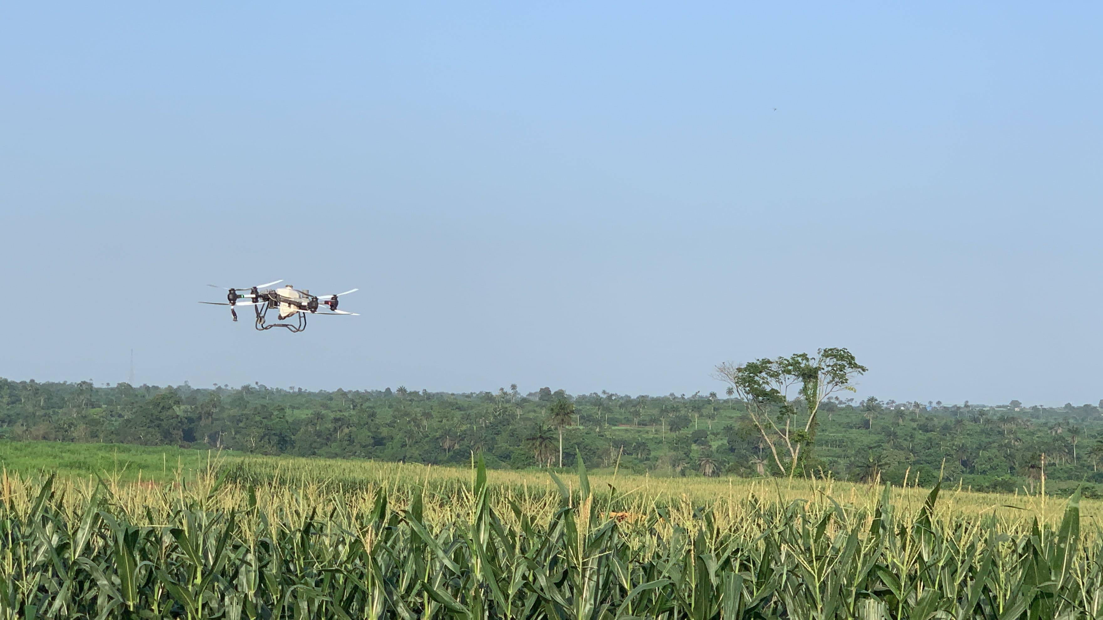 Agras drone spraying a farm